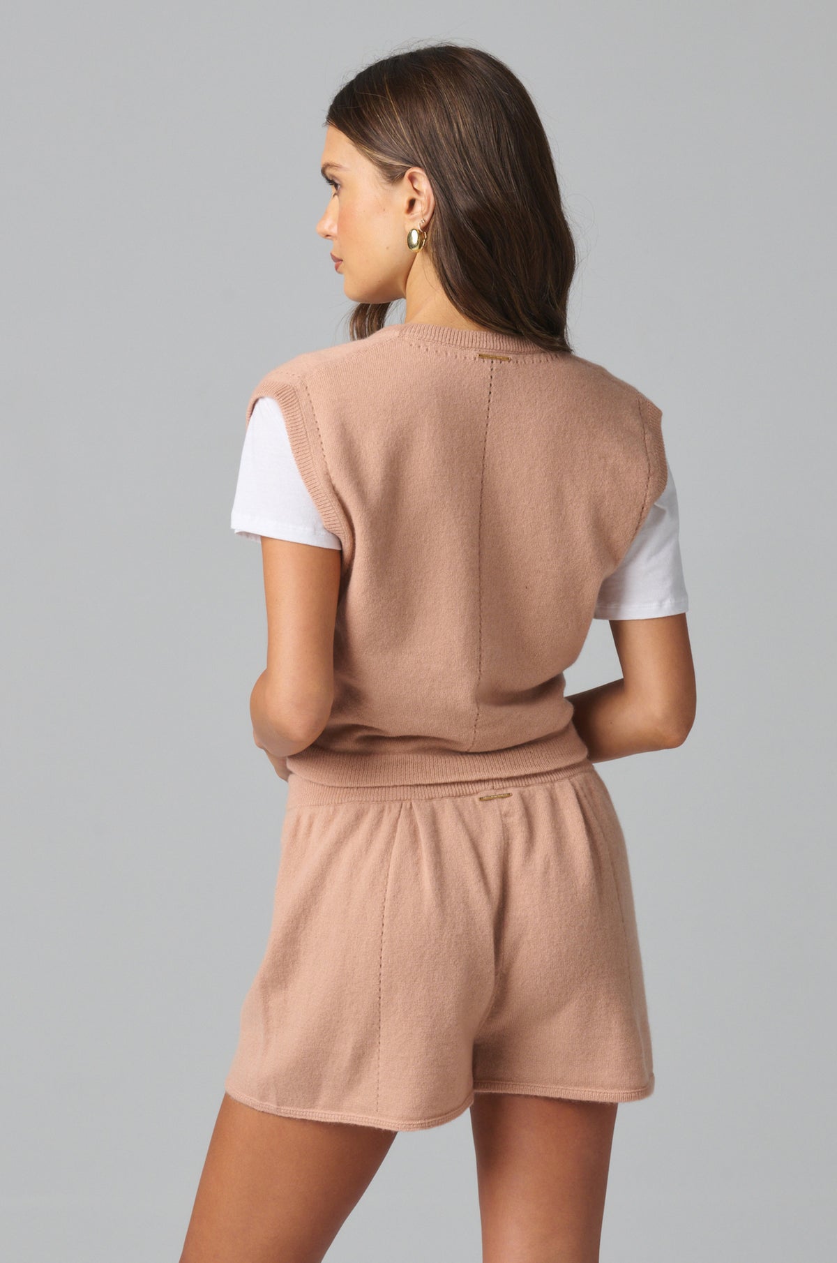 Simple, clean back with a relaxed shape and softly draped cashmere texture, finishing at the cropped hem.