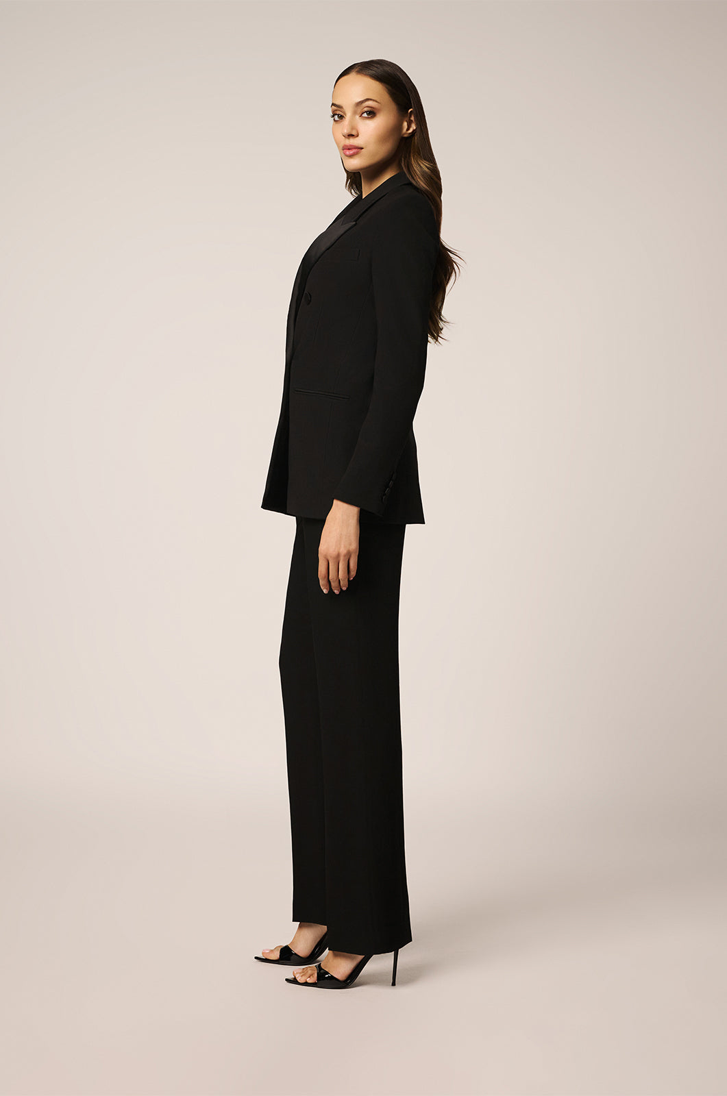 Blazer with double breasted closure in front, side view