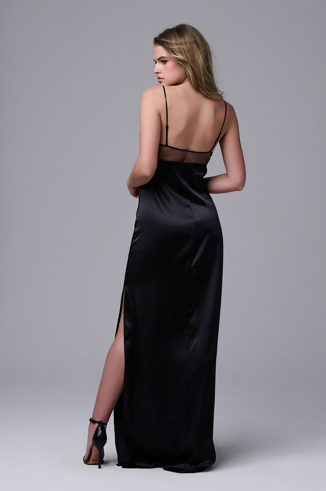 Triangular v-neck silk maxi slip dress with sheer bust outlining and thin straps back view