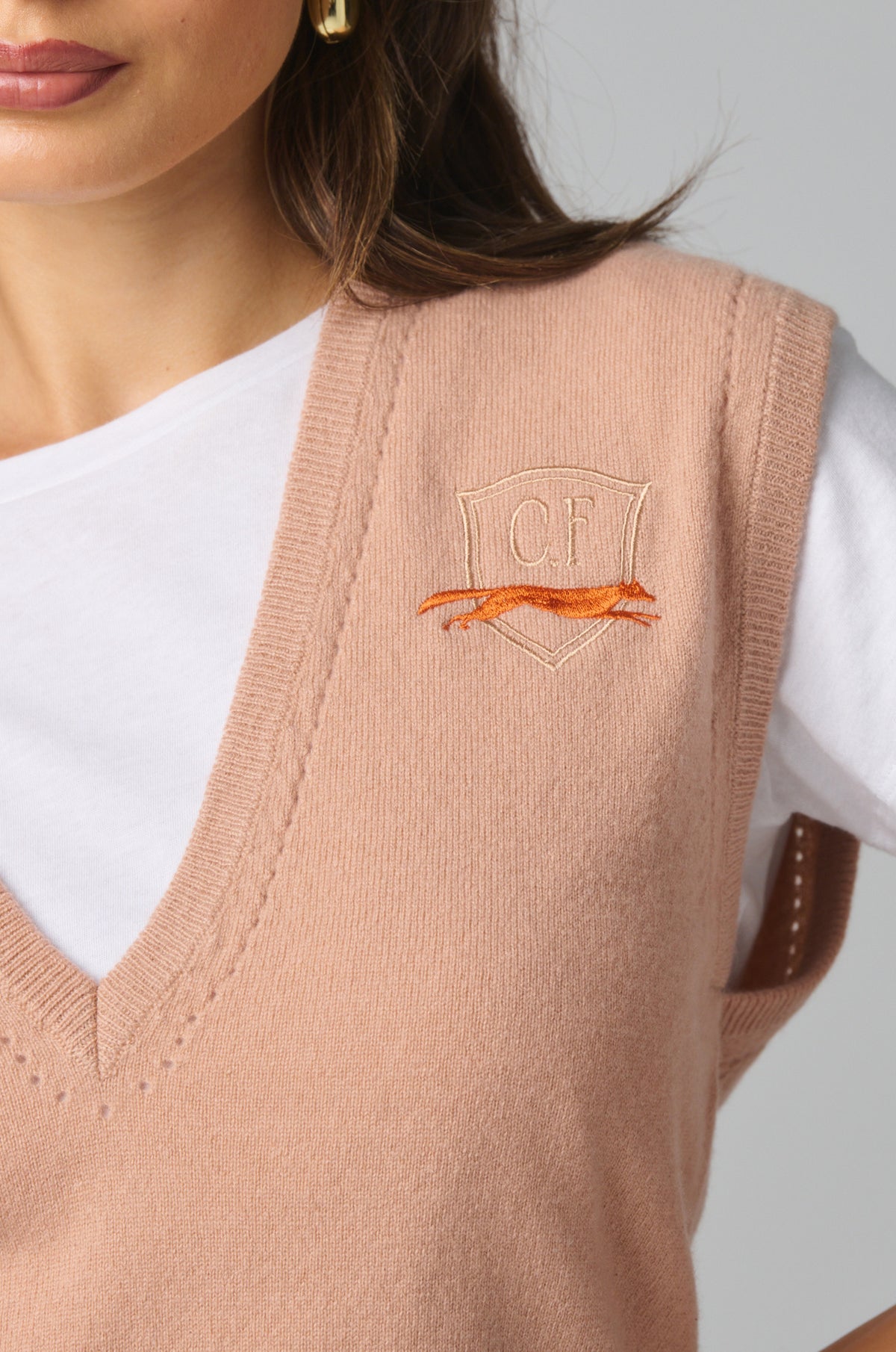 Relaxed cropped profile with soft draping through the torso and a comfortable fit around the waist.

