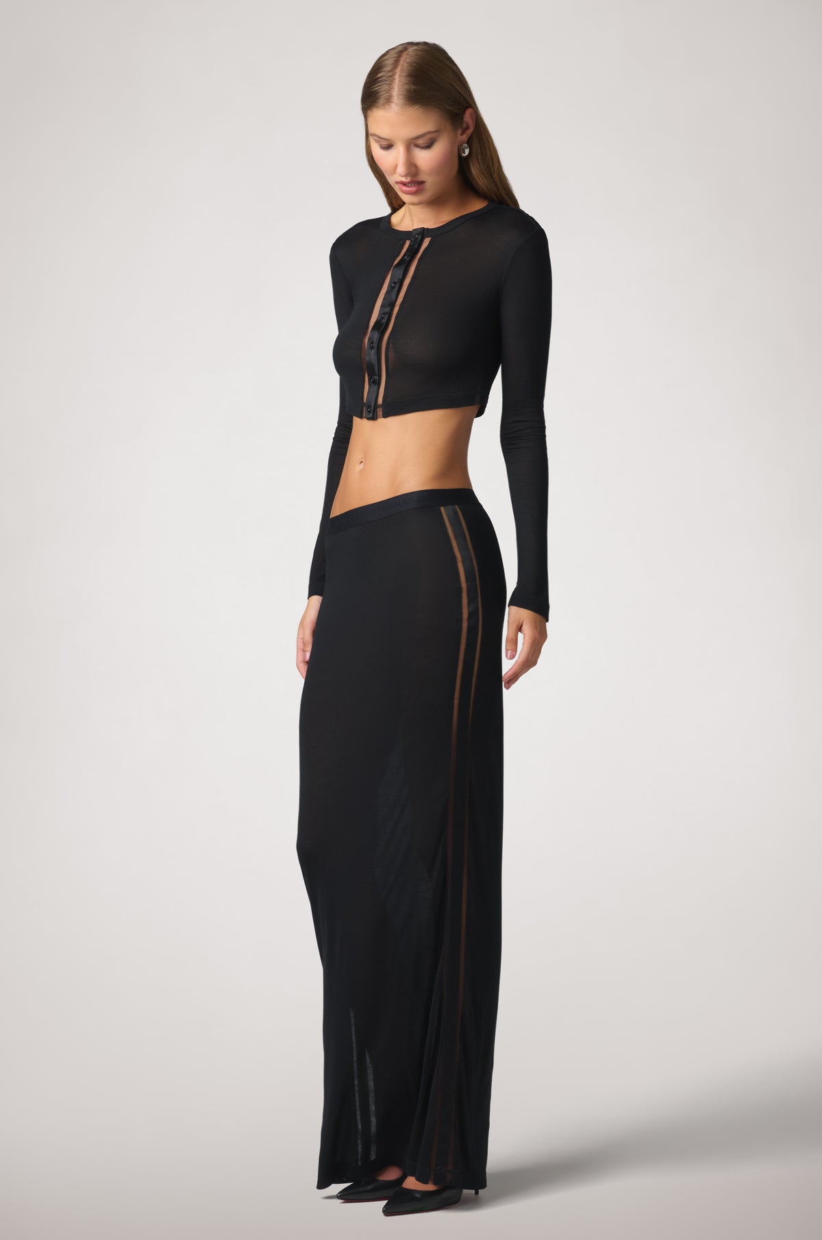 Kiki de Montparnasse, intime long skirt with the intime cropped long-sleeve cardigan in black, side.