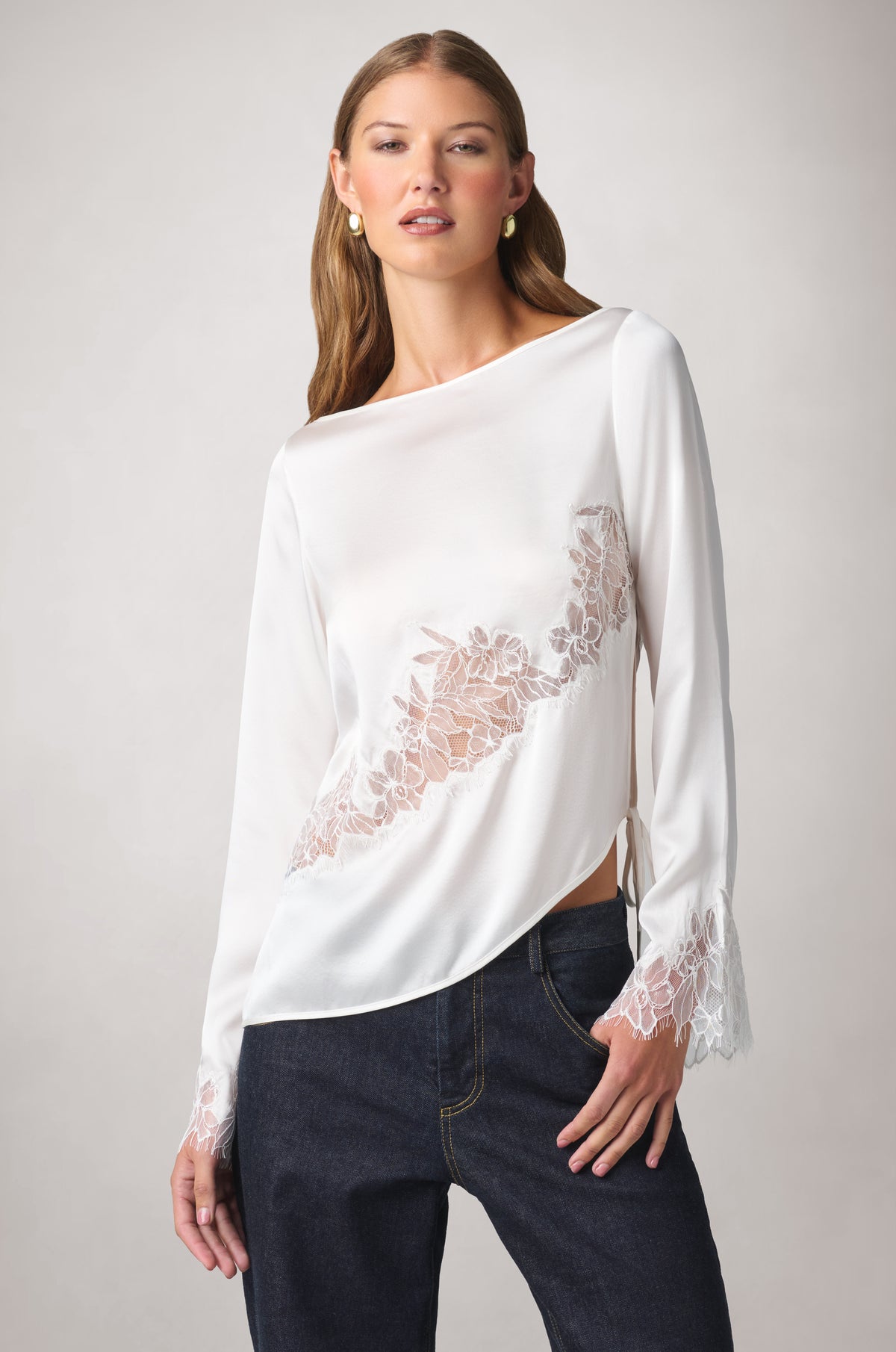 Kiki de Montparnasse fluid silk charmeuse and sheer Iris lace long-sleeve top with lace insets sweeping across the body and cuffs, shown from the front.