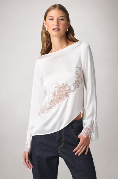 Kiki de Montparnasse fluid silk charmeuse and sheer Iris lace long-sleeve top with lace insets sweeping across the body and cuffs, shown from the front.