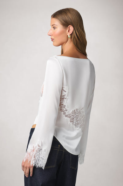 Kiki de Montparnasse fluid silk charmeuse and sheer Iris lace long-sleeve top, shown from the side with an open side and delicate tie detailing.