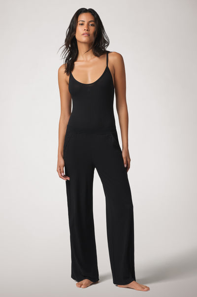 Kiki de Montparnasse Le Boy Bodysuit in black stretch rib knit with track pant front
