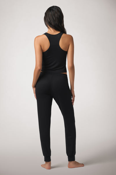 Kiki de Montparnasse Le Boy Jogger in soft black stretch rib knit with racer tank, back.