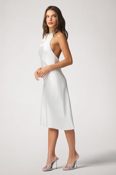 Kiki de Montparnasse fluid silk charmeuse halter with a sleek, body-skimming silhouette and softly draped fabric, shown from the side.