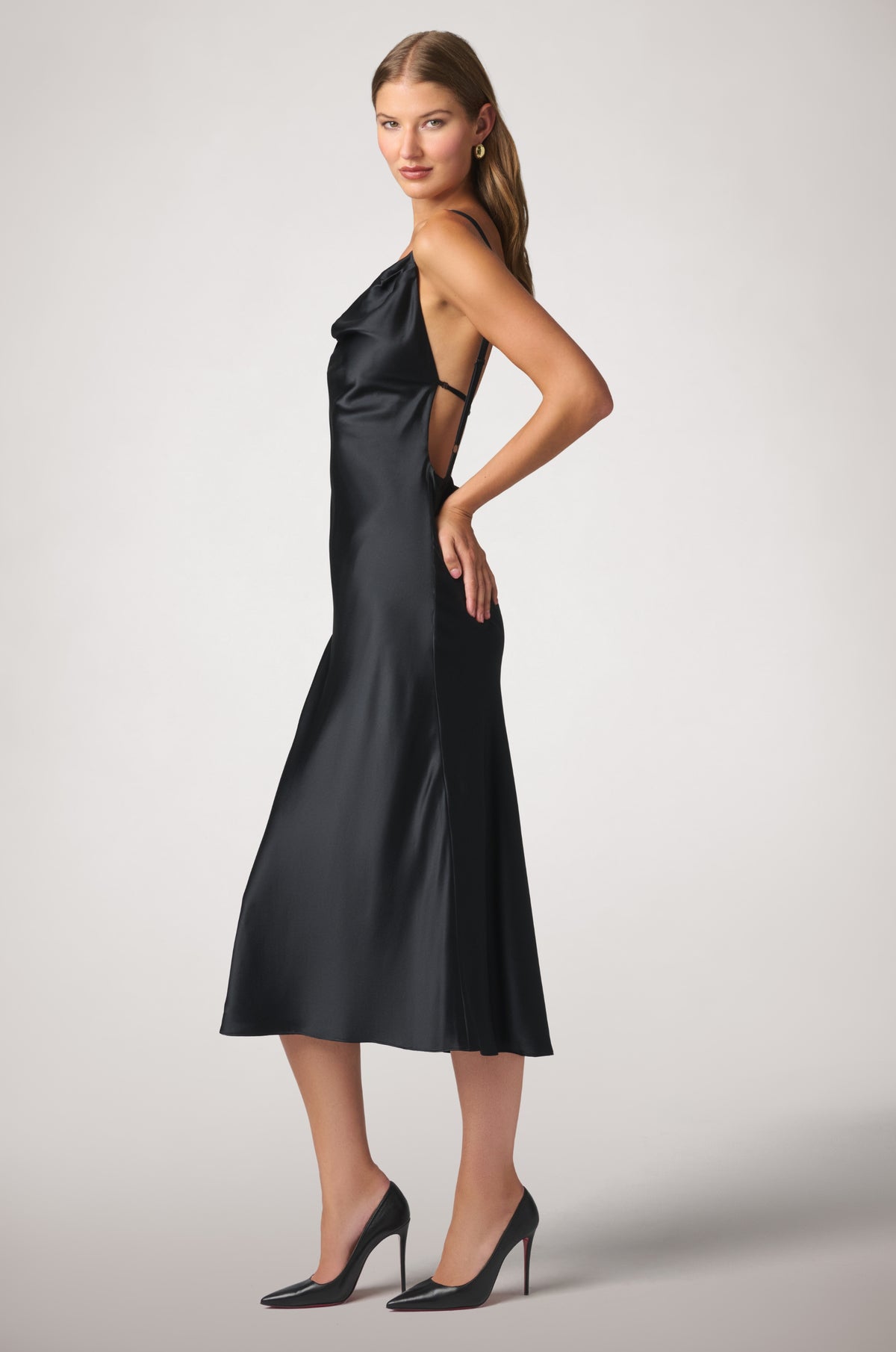 Kiki de Montparnasse fluid silk charmeuse dress with a sleek, feminine silhouette and delicate straps, shown from the side.