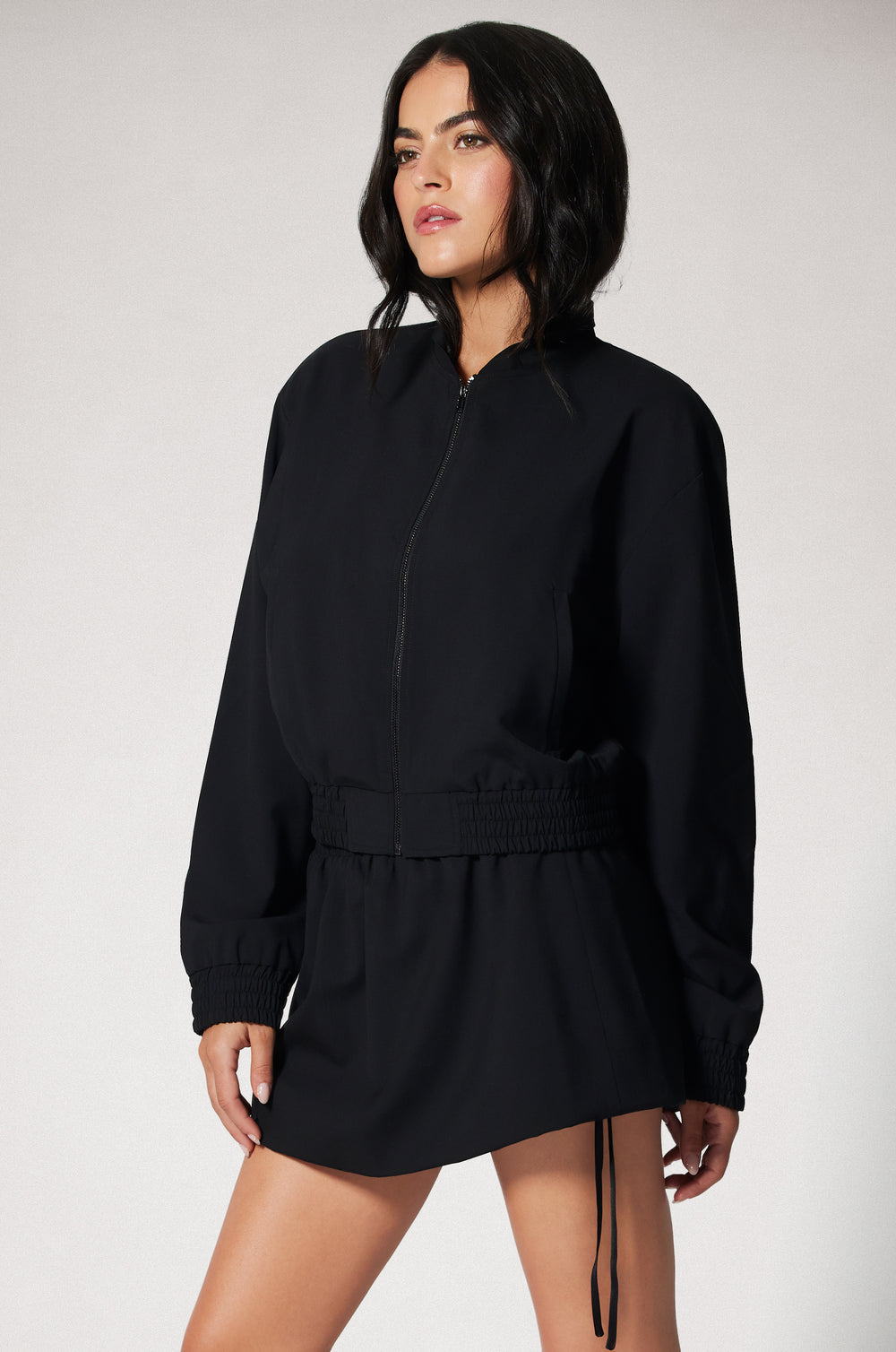 Black Cropped Cinched End Mock Neck Gold Zip Up Suiting Bomber Jacket Side