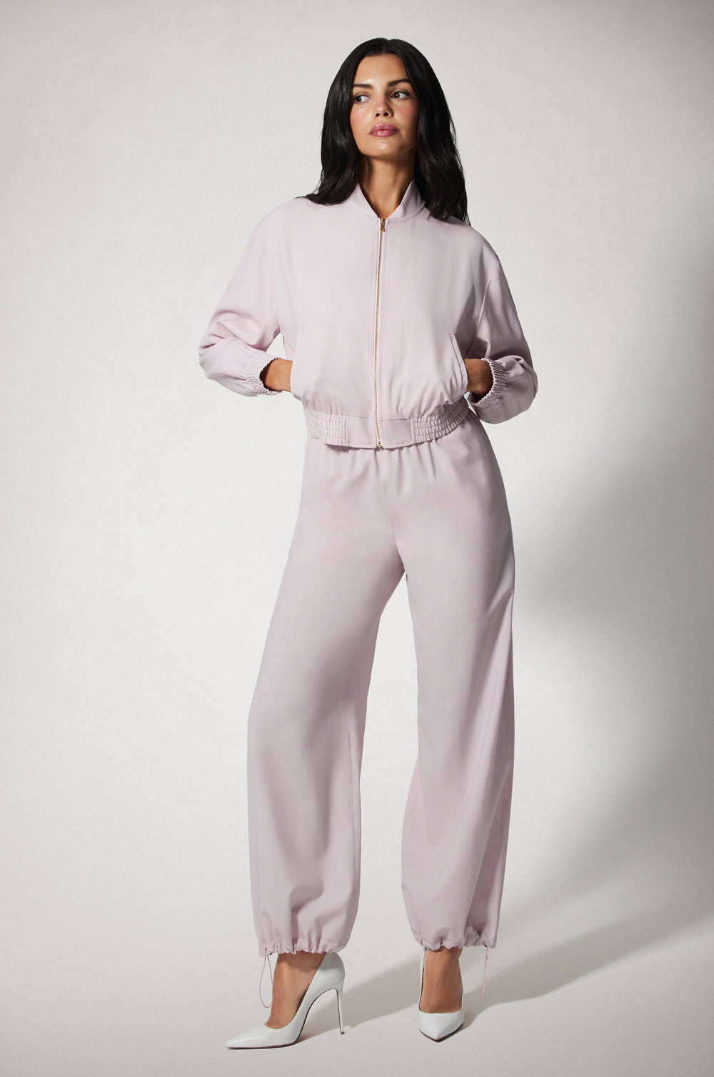 Light Pink Cropped Cinched End Mock Neck Gold Zip Up Bomber Jacket Front