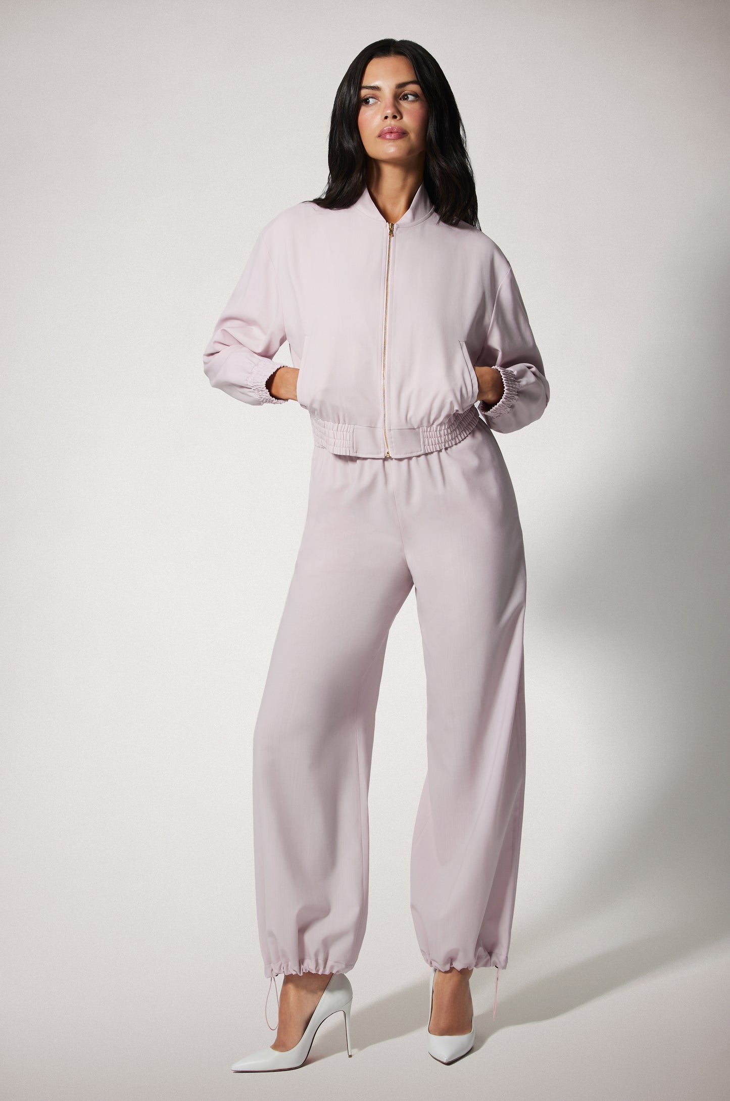 Light Pink Cropped Cinched End Mock Neck Gold Zip Up Bomber Jacket Front