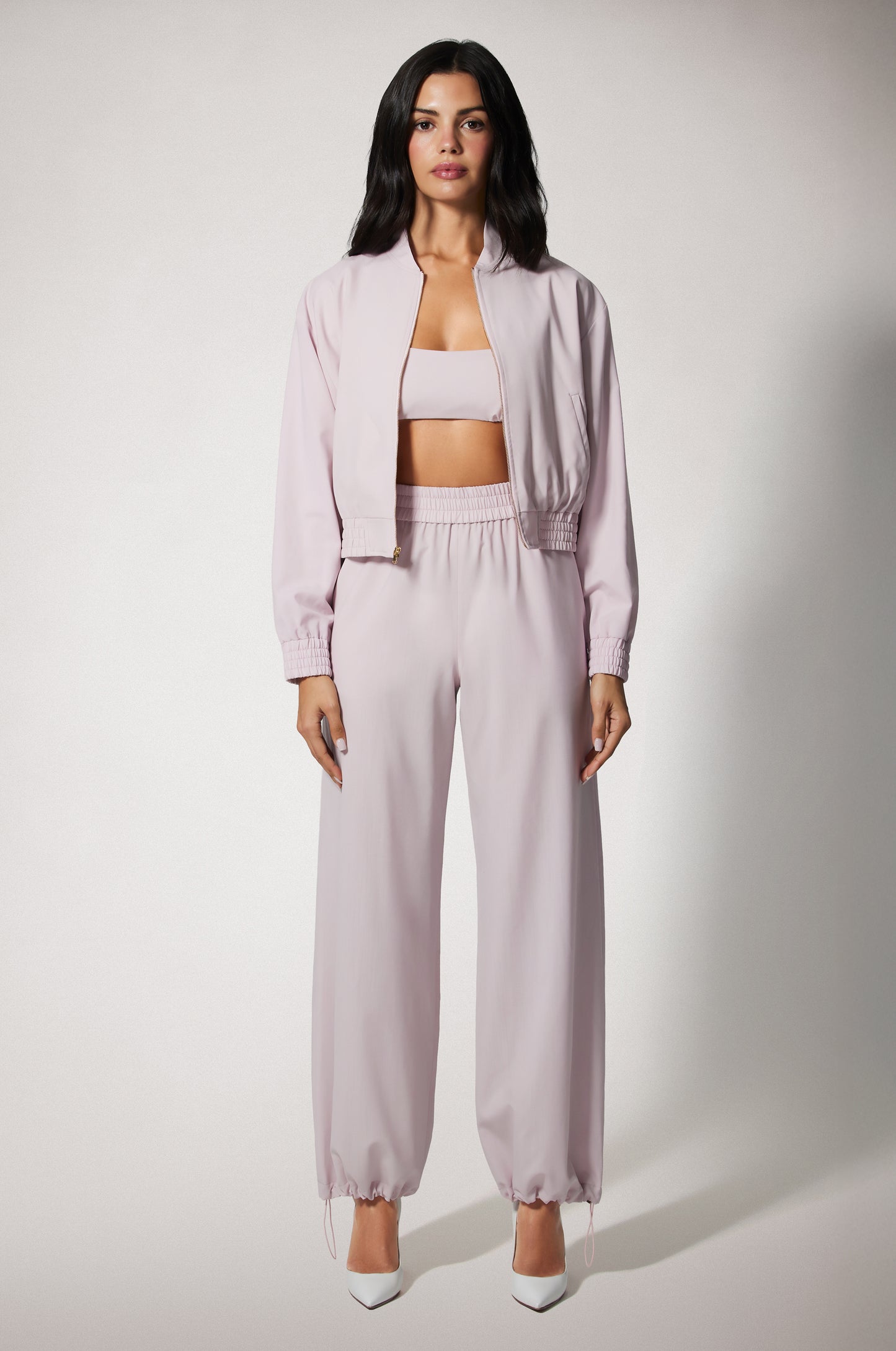 Light Pink Cropped Cinched End Mock Neck Gold Zip Up Bomber Jacket and Pant Front